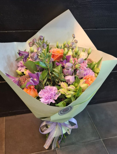 Wrap of Loveliness - A simple wrap of mixed flowers to convey your message will be put together from the finest collection of flowers on the day by a real local florist.