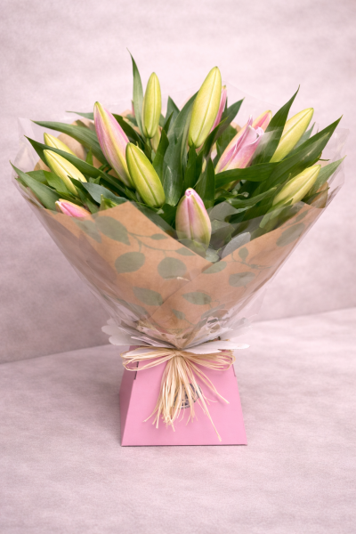 Bright Ideas - Beautiful Sunflowers and a peppering of other summer flowers and foliage. Tied in water and presented in a stylish bag. An amazing bouquet full of joy and delight ready to display and enjoy.