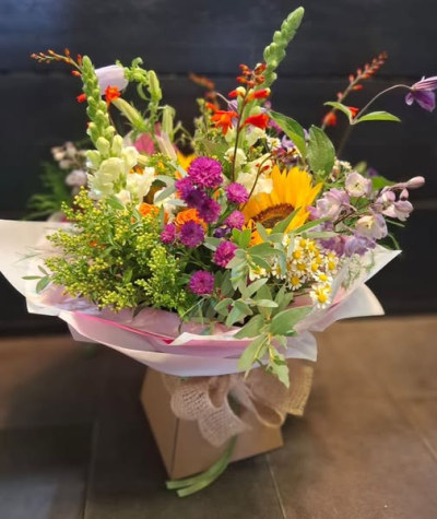 The Wild Summer Garden Edition - A timeless bouquet brimming with seasonal charm, this arrangement is thoughtfully crafted using the finest blooms of the moment. Inspired by the beauty of an English country garden, each stem is hand-selected for its colour, texture, and fragrance, creating a composition that feels both effortless and refined. Soft, natural tones blend harmoniously with delicate foliage, evoking the romance of freshly gathered garden flowers.

Perfect for birthdays, anniversaries, celebrations, or simply to brighten someone’s day, this bouquet is a versatile and sophisticated choice for any occasion. Lovingly arranged by our skilled florists and finished with elegant wrapping, it’s a gift that captures the essence of the season and the beauty of nature.