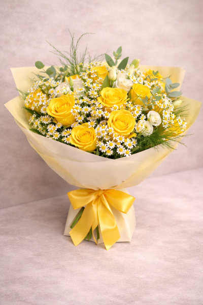 Bright Days Signature Edition - Buttery yellow roses with delicate chamomile-style daisies and soft white blooms, finished with airy greenery for a fresh, uplifting feel.