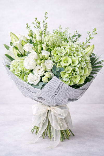 Verdant White No. 12 - A fresh, sculptural bouquet featuring green hydrangea, white lisianthus, lily and soft eucalyptus, designed in crisp white and soft green tones with a modern garden feel.