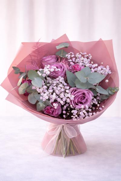Rose Mist No. 89 - A romantic pink rose bouquet featuring mauve roses, soft gypsophila, eucalyptus and delicate seasonal detail, hand-tied for an elegant, modern finish. Perfect for birthdays and anniversaries. 
One of the owners favourites.