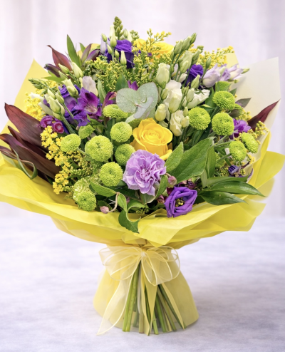 Citrus Violet No. 24 - A vibrant hand-tied bouquet featuring yellow roses, violet lisianthus, green button chrysanthemums and fresh seasonal blooms, designed for a bright, modern garden-style finish.
